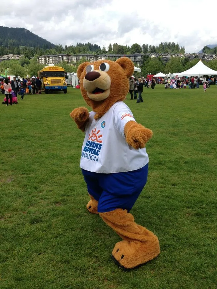 Callan Morrison volunteering as the Sunny Bear mascot at a community event.